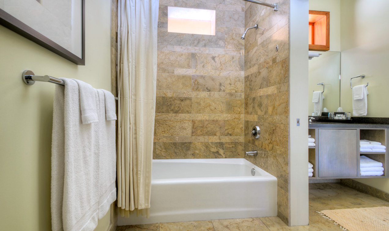 Desert Pearl Inn Premium King large clean bathroom features privacy area and bidet.